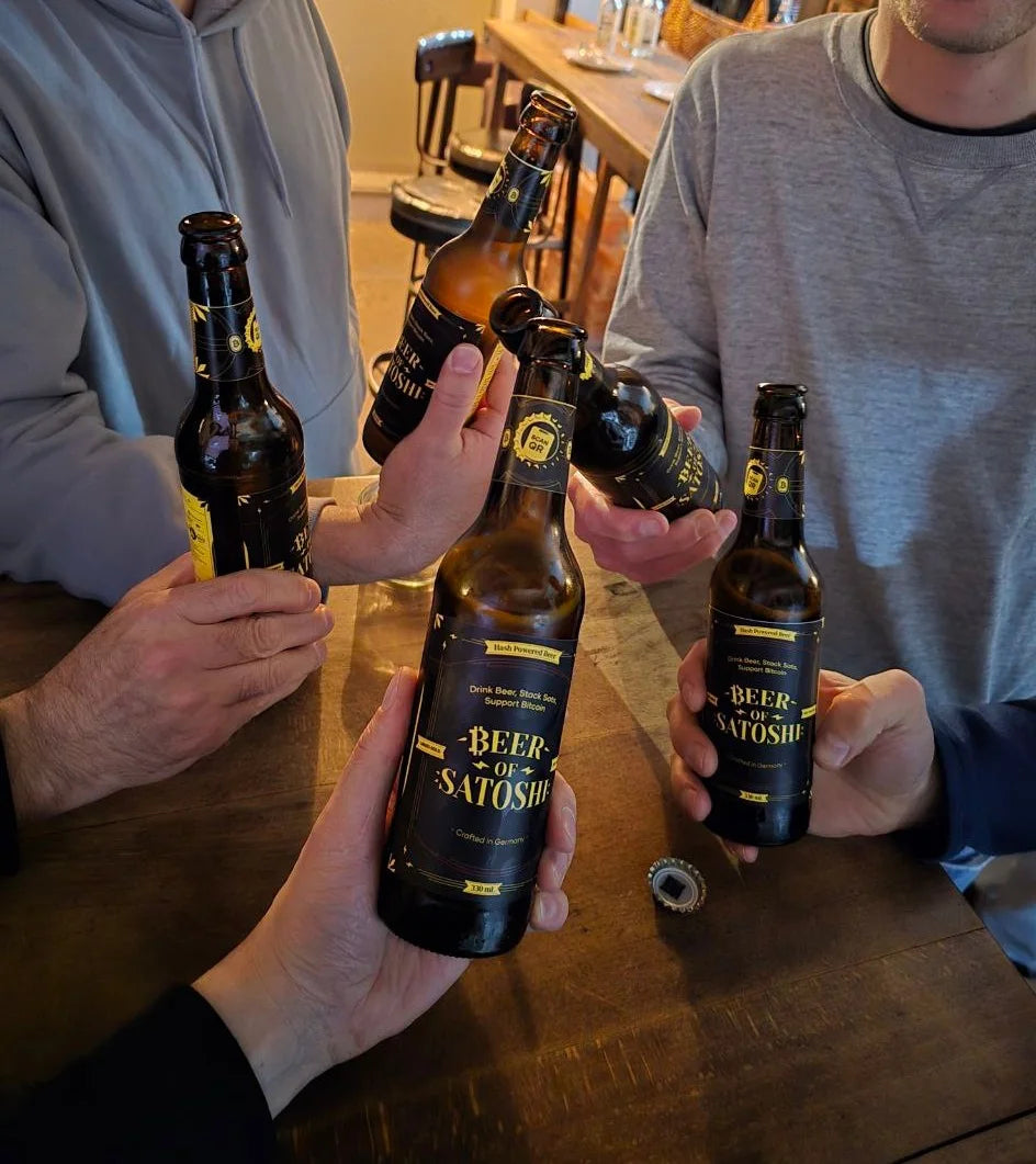 People sharing Beer of Satoshi at a community event
