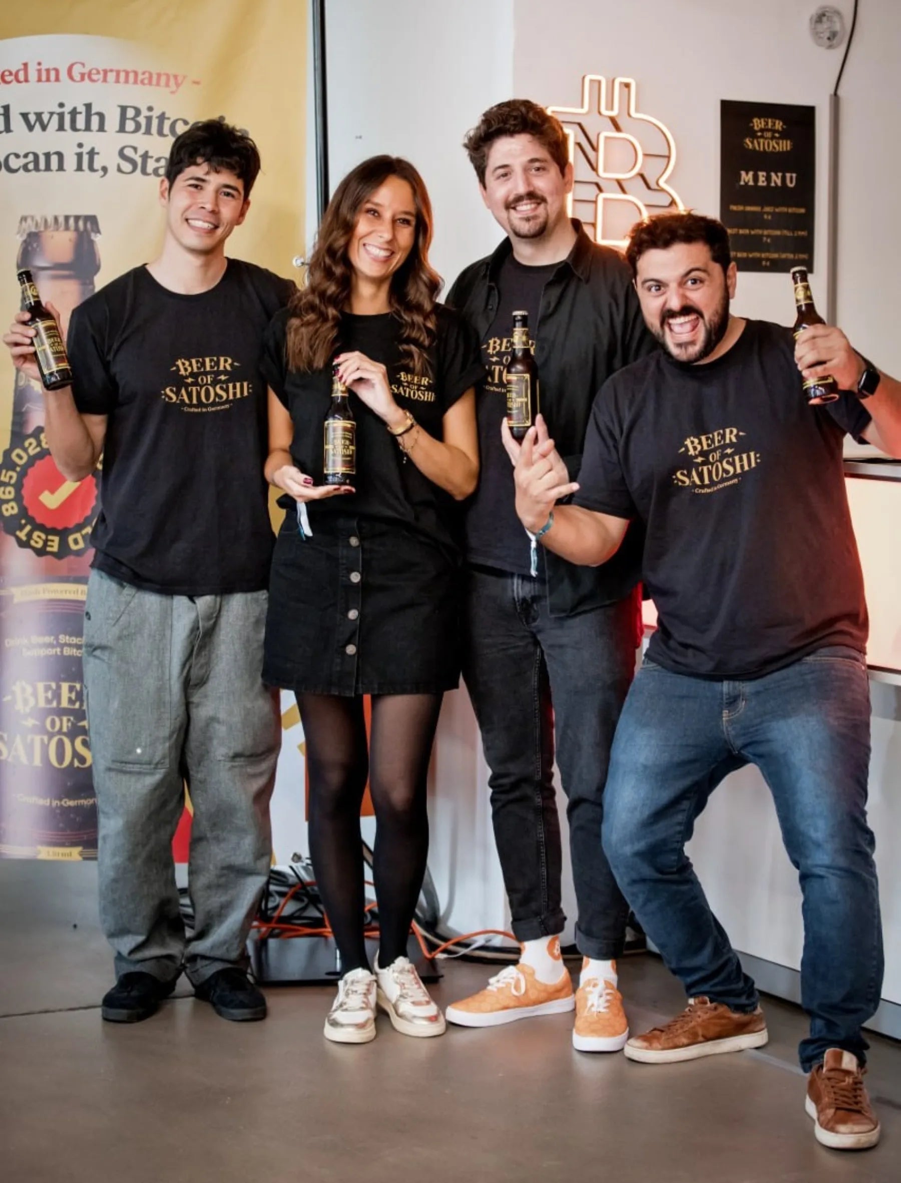 Beer of Satoshi team helping visitors at a Bitcoin event