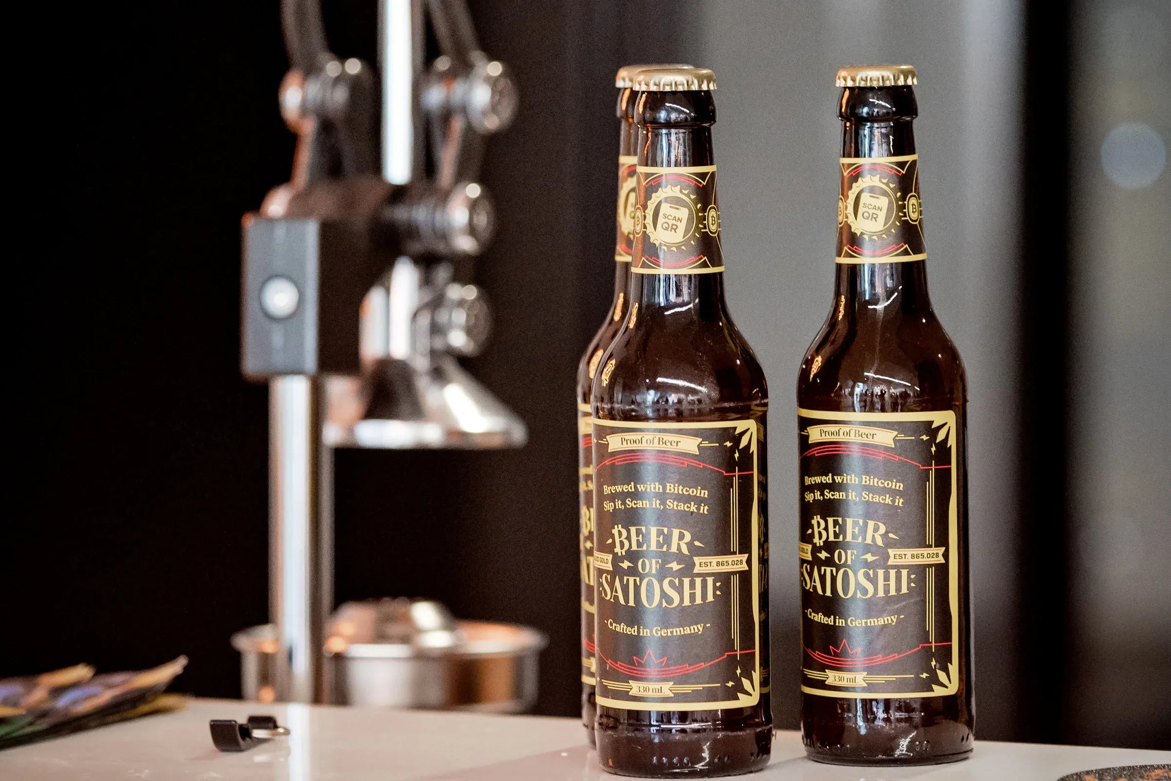 Beer of Satoshi Genesis Lager bottles presented at Blocktrainer Cologne